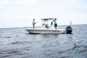 side shot three people fishing