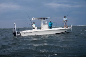 side shot three men fishing